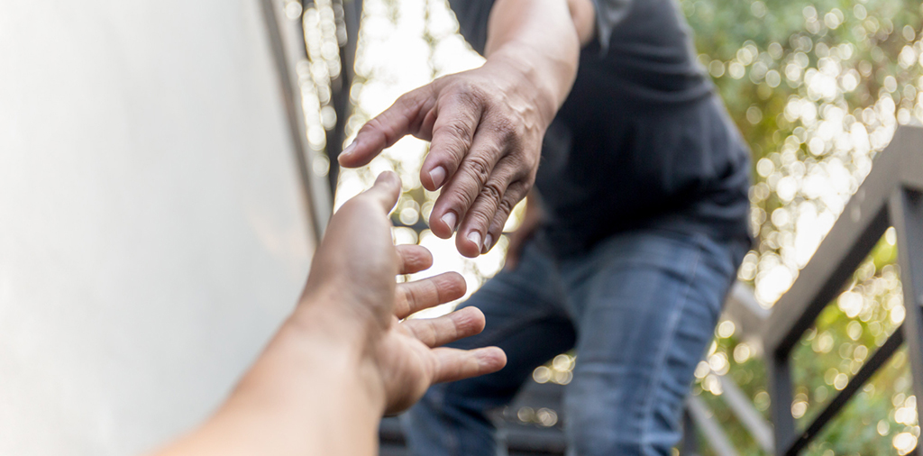 help-concept-hands-reaching-out-help-each-other-with-bokeh-background